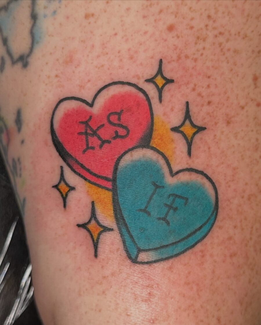 Charming candy heart tattoo design featuring fun phrases