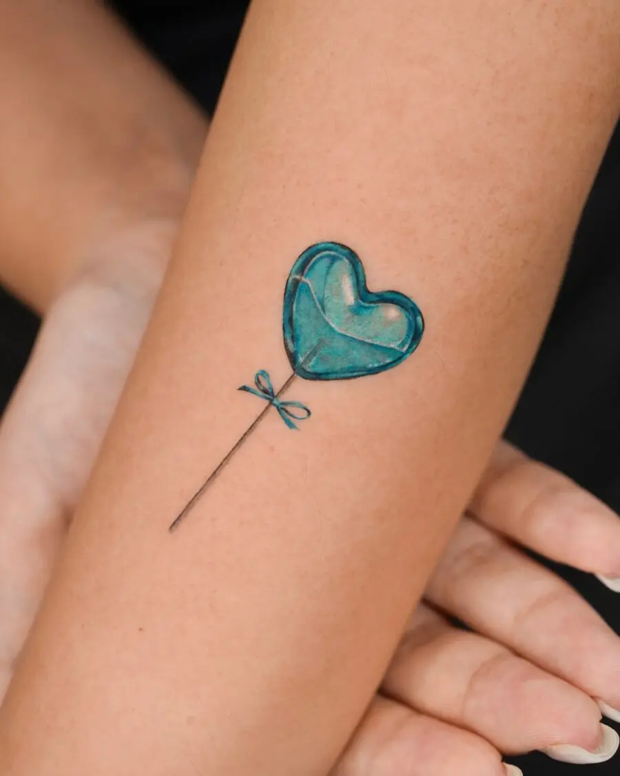 Charming blue heart balloon tattoo design