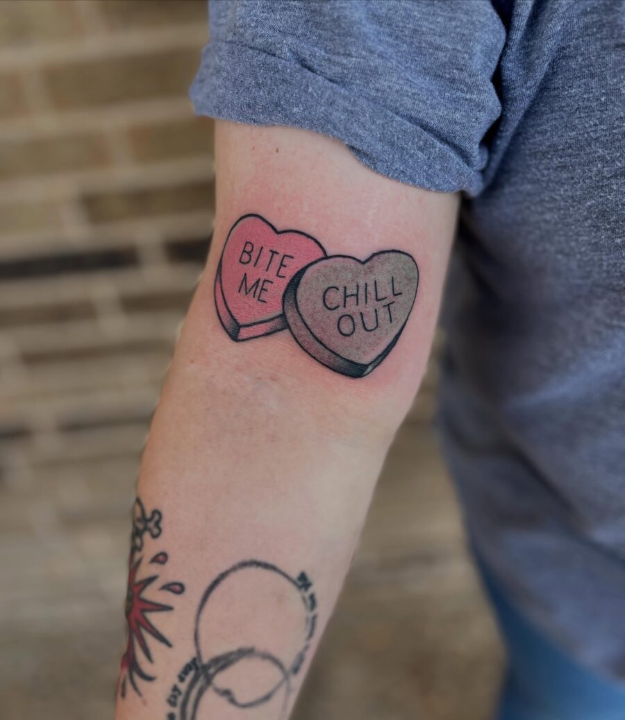 Playful candy heart tattoos with fun phrases