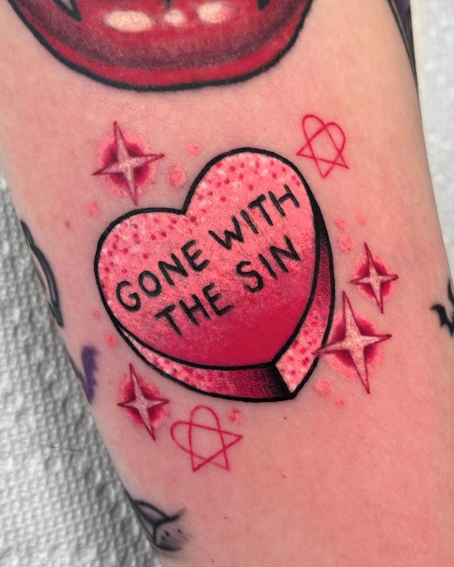 Playful candy heart tattoo with a twist