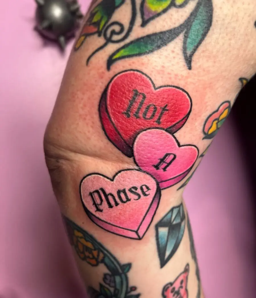 Playful and bold candy heart tattoo design