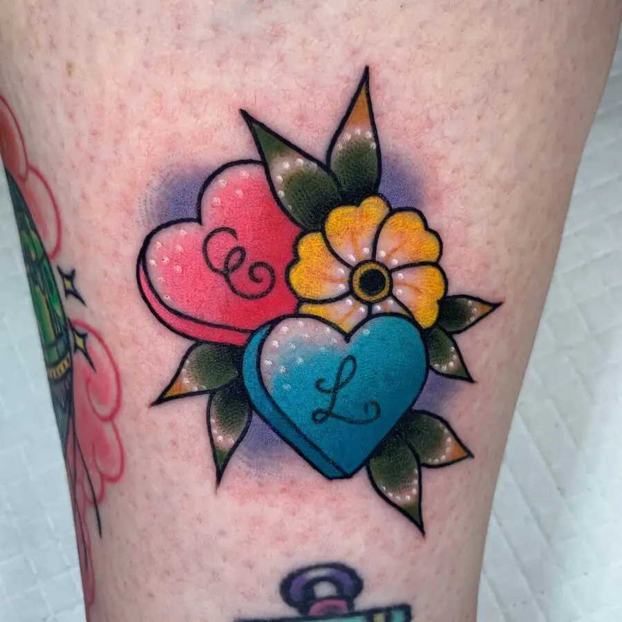 Colorful candy heart tattoo with floral accents