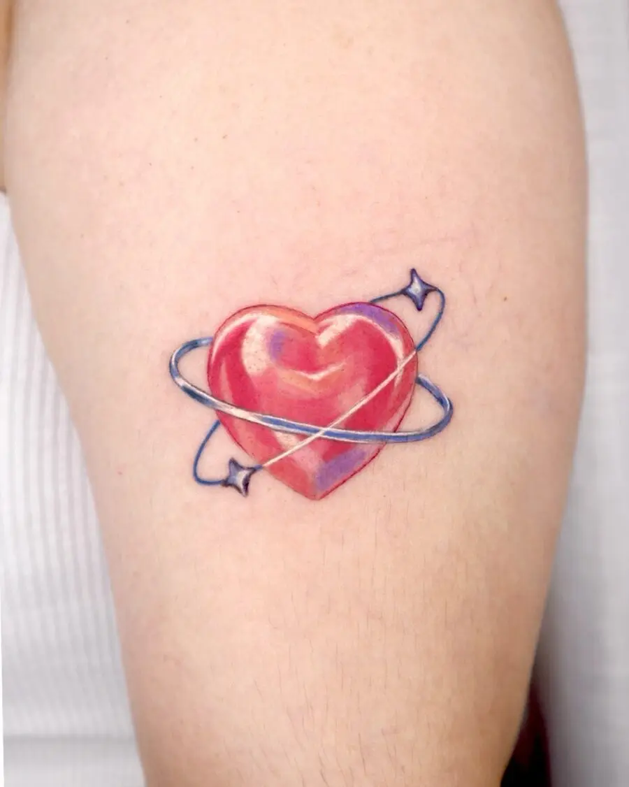 Bright heart tattoo with planetary orbit theme