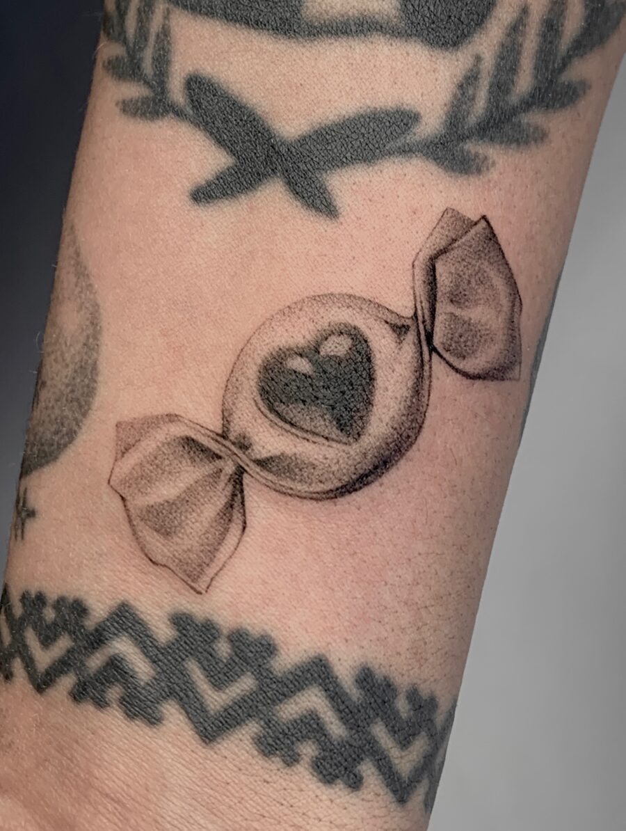 Charming candy heart tattoo with delicate details