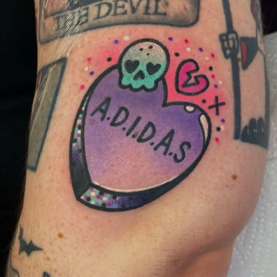 Whimsical skull candy heart tattoo design