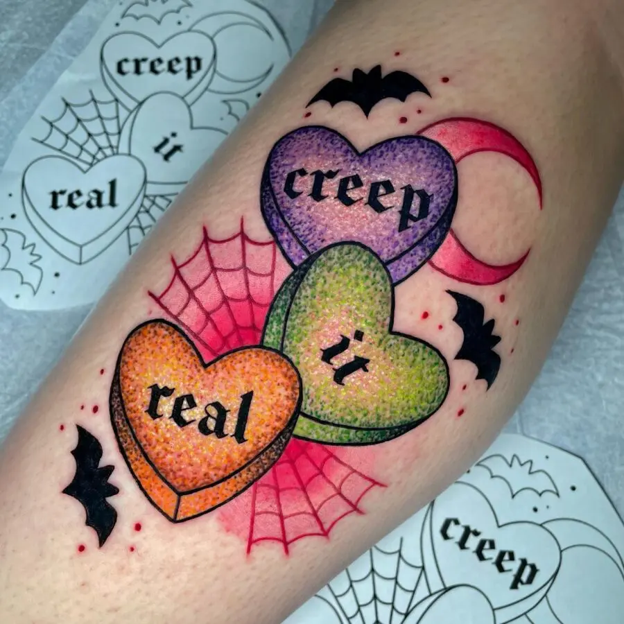Colorful candy heart tattoo with spooky vibes