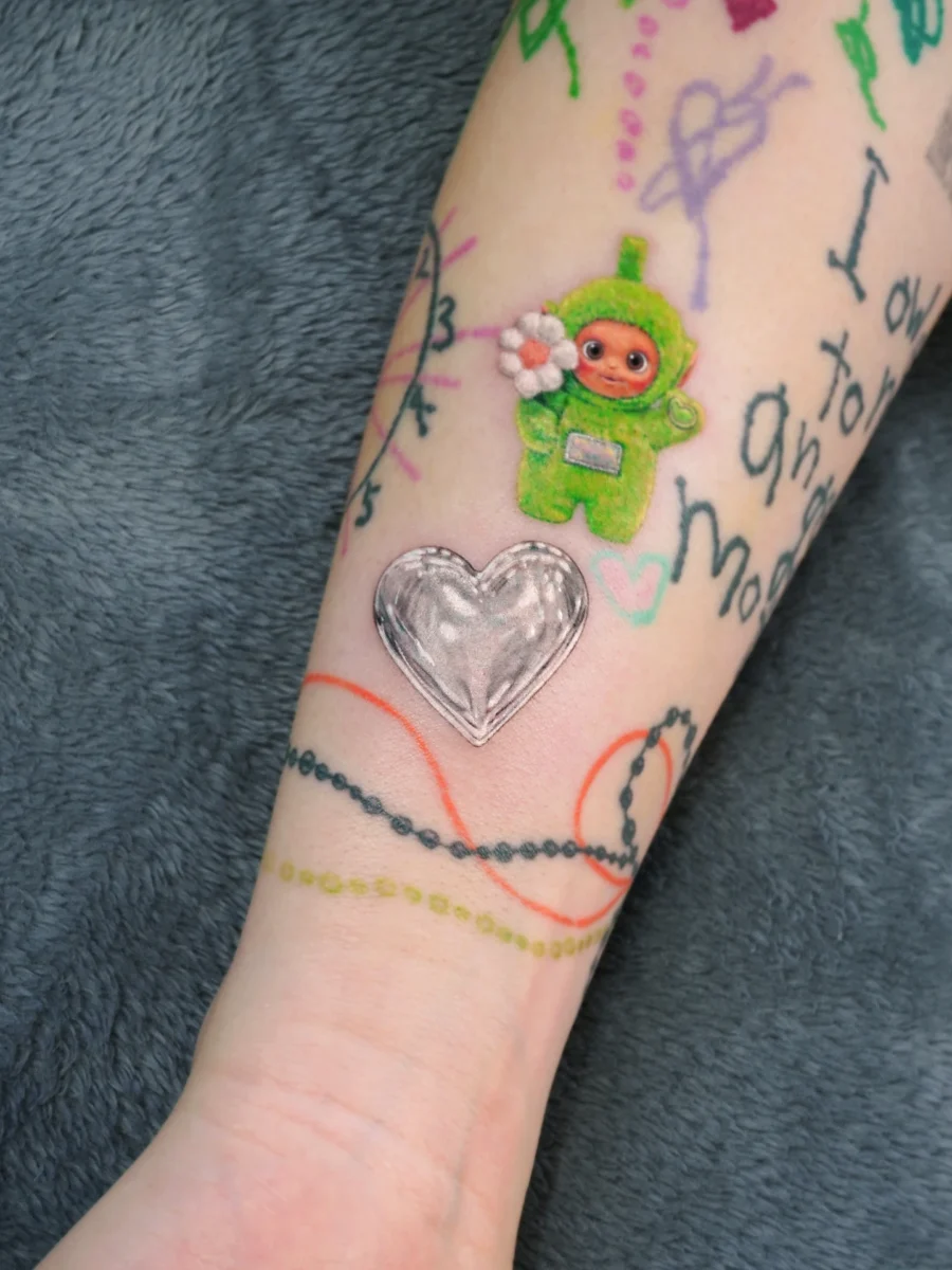 Playful candy heart tattoo with a charming twist