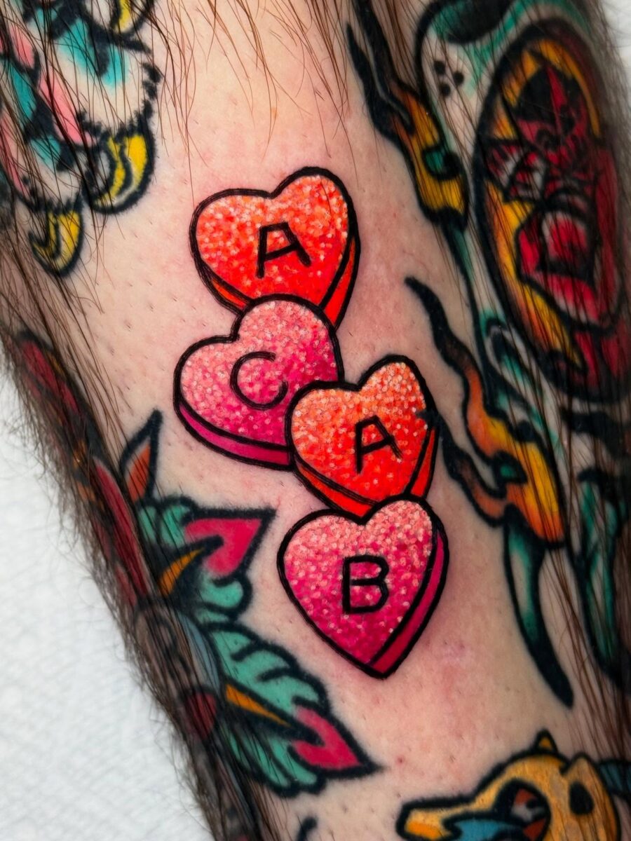 Colorful candy hearts tattoo with playful letters
