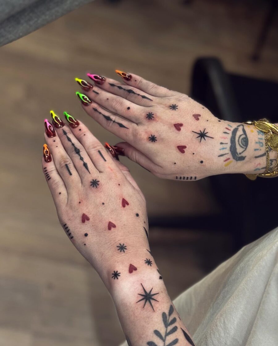 Vibrant Candy Heart Tattoos on Hands