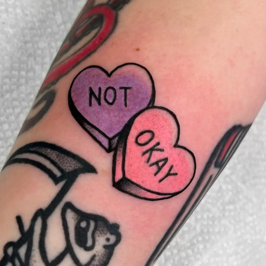 Cute yet edgy candy heart tattoo design