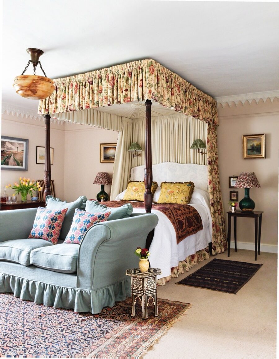Elegant canopy bed with vintage furnishings