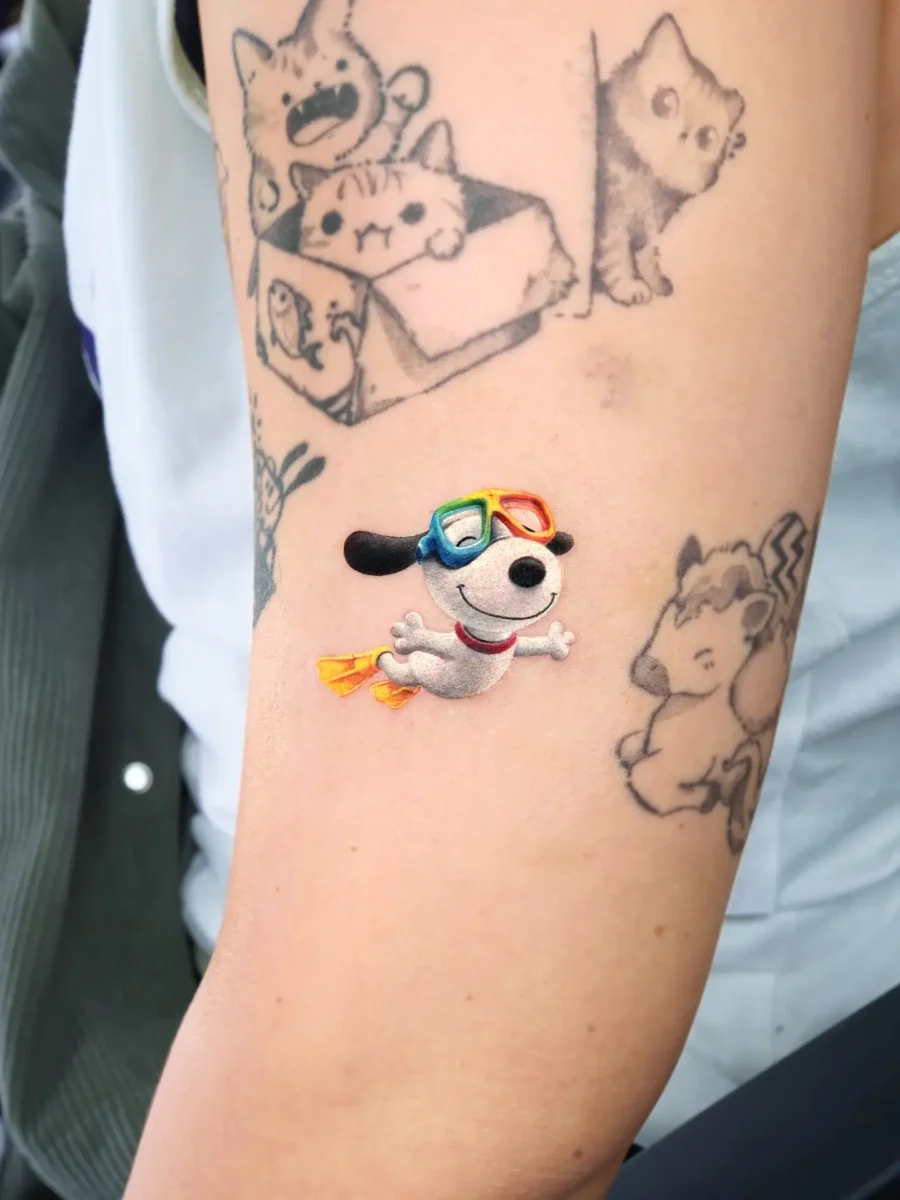 Whimsical dog tattoo with colorful sunglasses