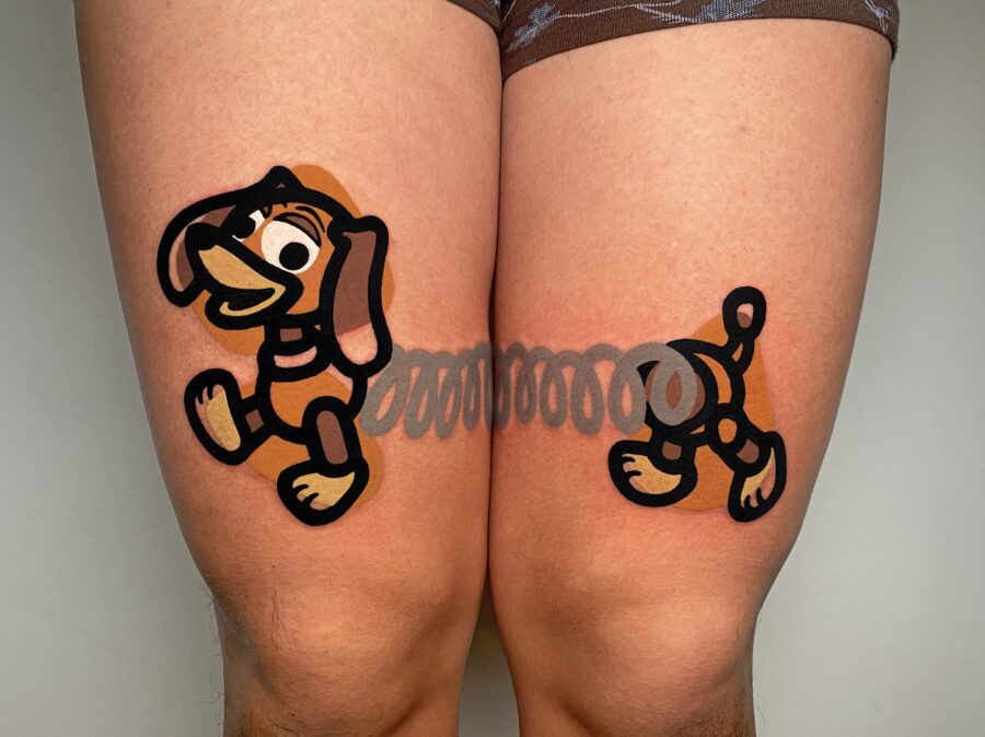 Fun cartoon dog tattoos on thighs