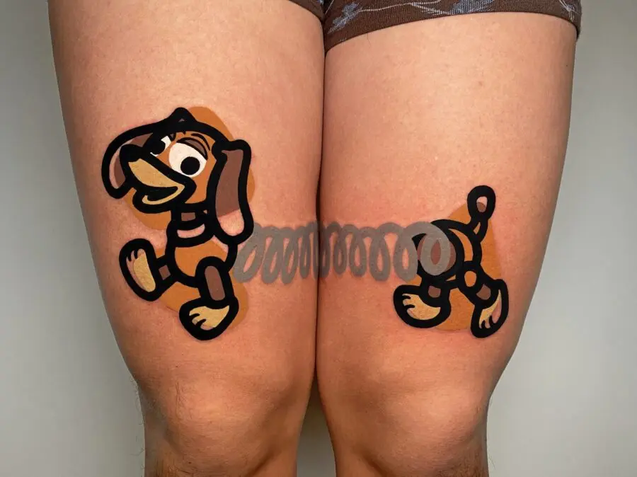 Fun cartoon dog tattoos on thighs