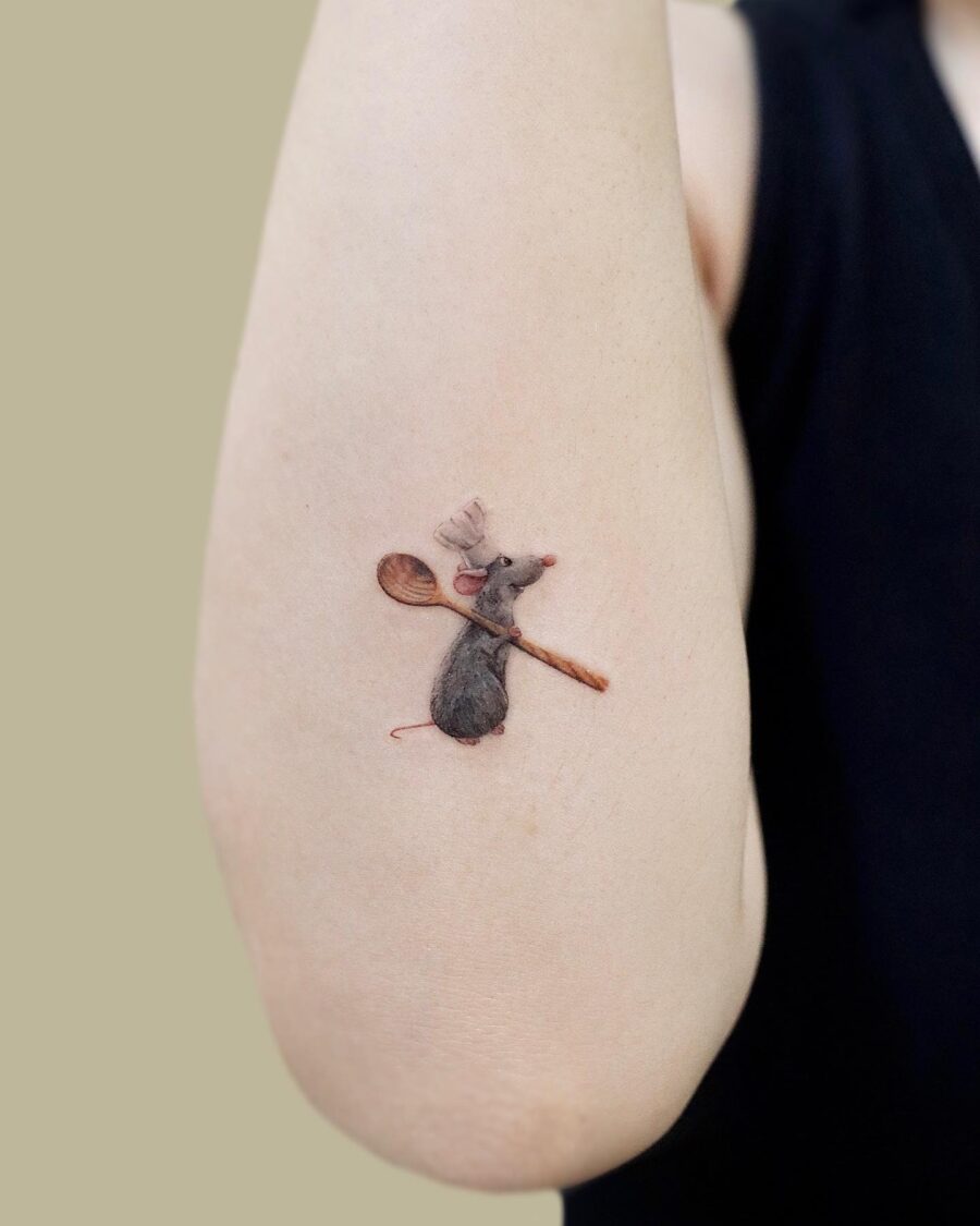 Charming cartoon mouse tattoo with a spoon