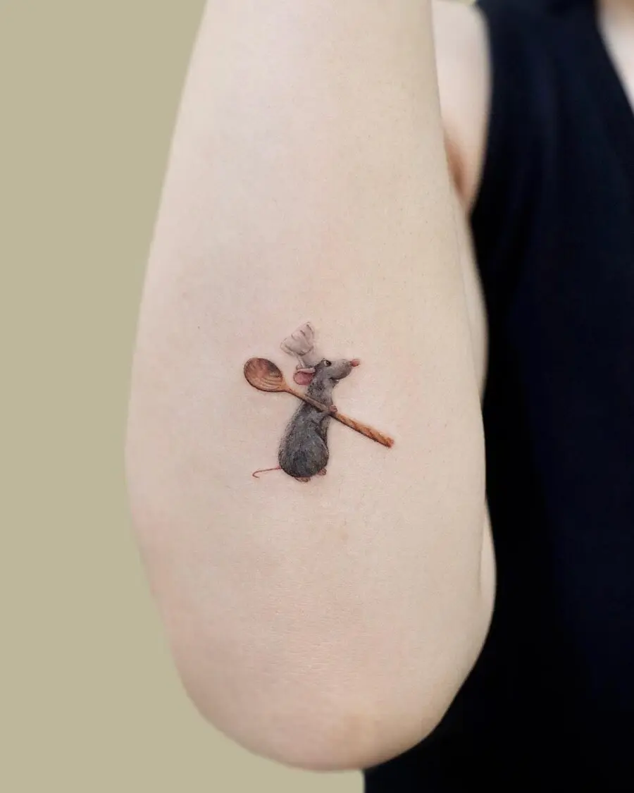 Charming cartoon mouse tattoo with a spoon