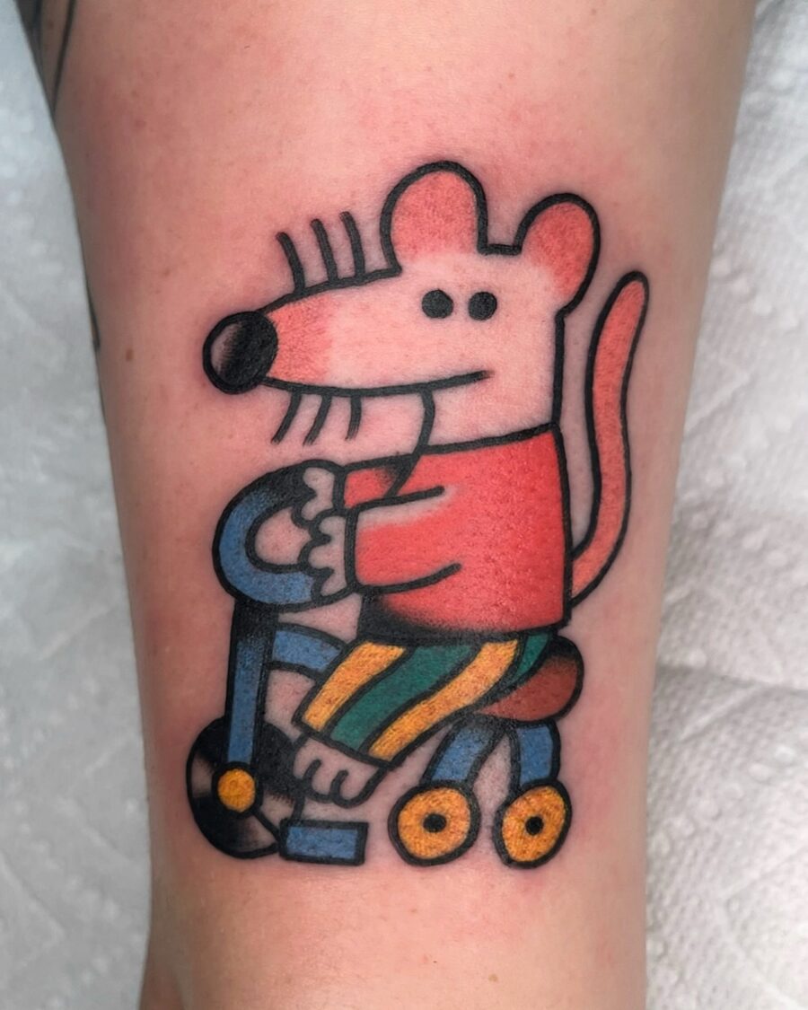 Whimsical cartoon tattoo with a playful mouse