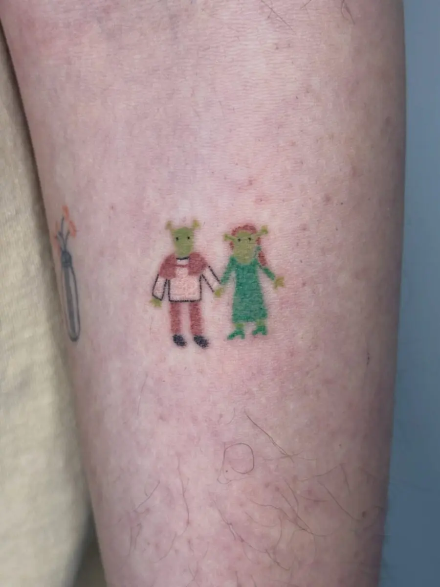 Adorable Shrek and Fiona cartoon tattoo design