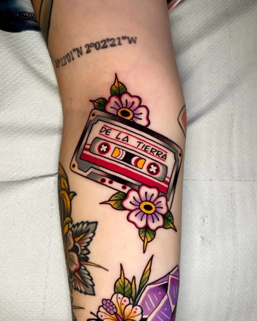 Colorful cassette tattoo with floral accents