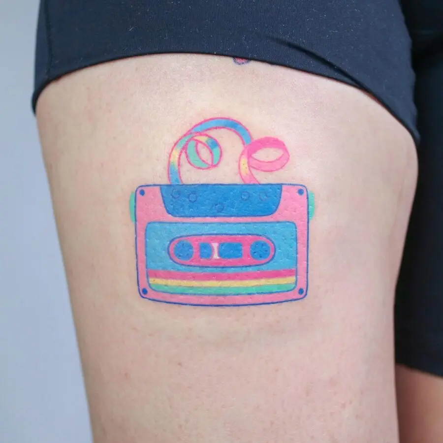 Colorful cassette tape tattoo on thigh