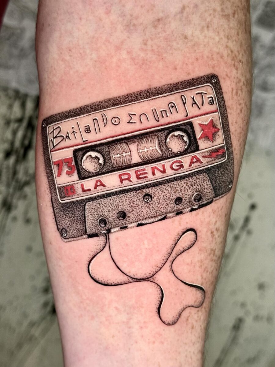 La Renga cassette tape tattoo with playful vibe
