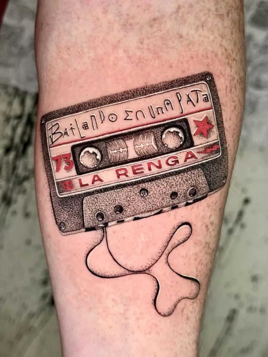 La Renga cassette tape tattoo with playful vibe