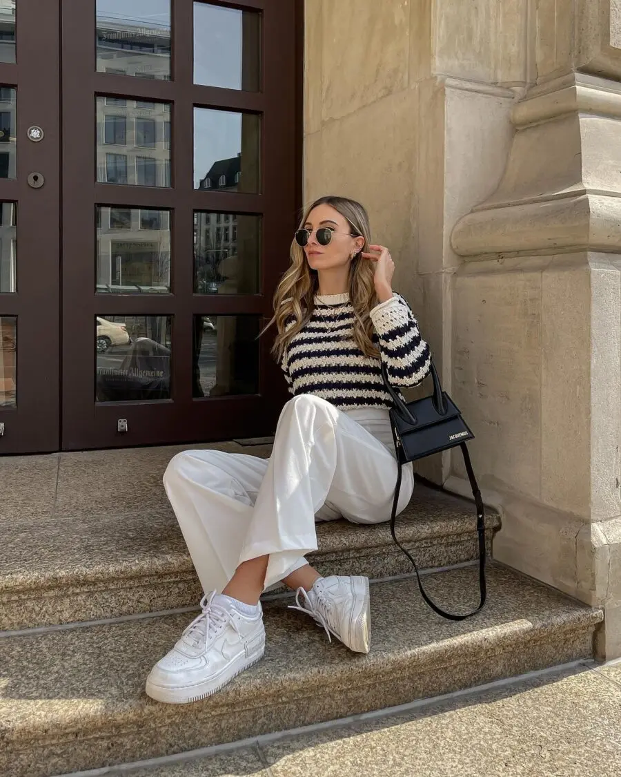 Stylish outfit featuring white sneakers and stripes