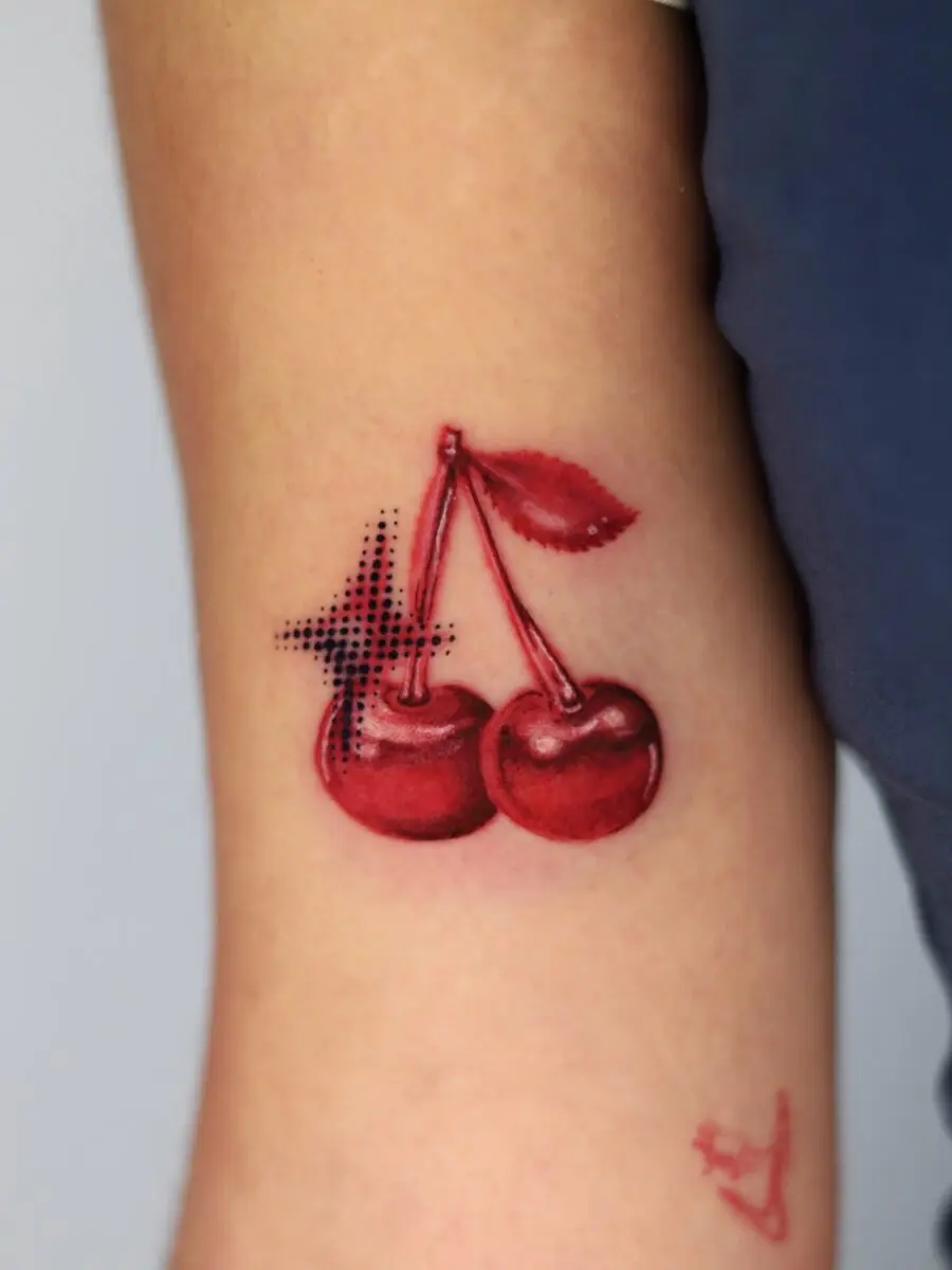 Vibrant Cherry Tattoo with Bold Detailing