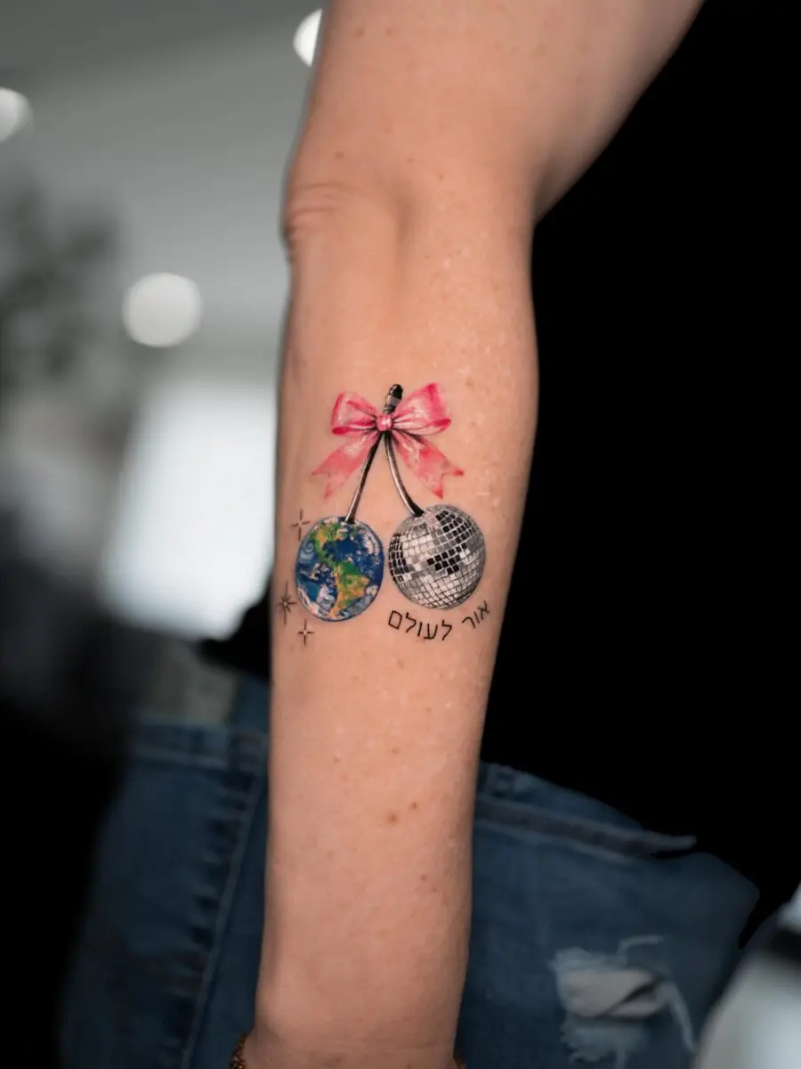 Whimsical globe and disco ball tattoo