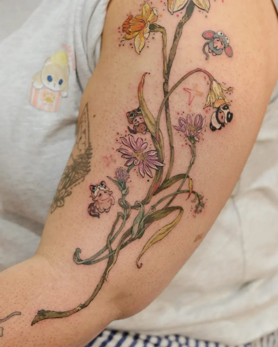 Vibrant birth flower tattoo with playful characters