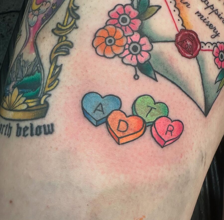Colorful candy heart tattoos with letters