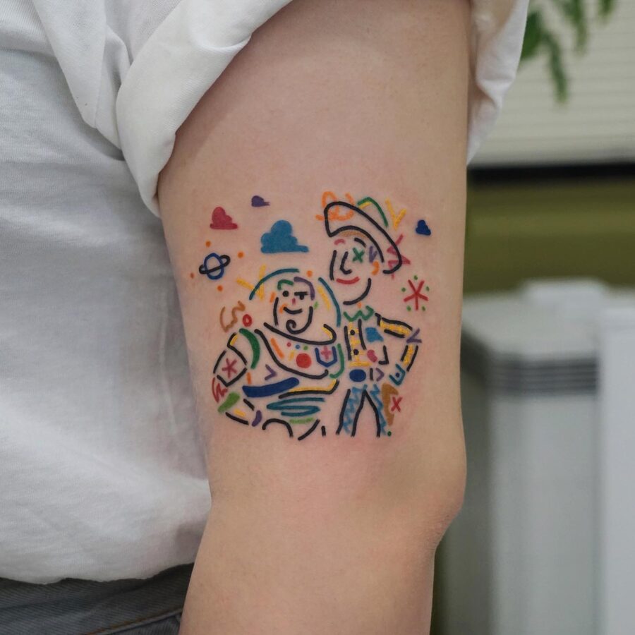 Whimsical Buzz and Woody cartoon tattoo art