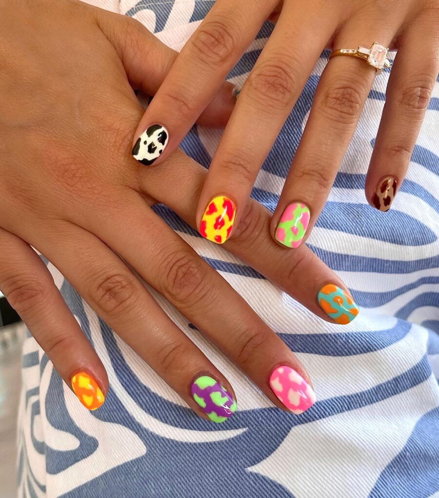 Vibrant cow print nails for playful vibes