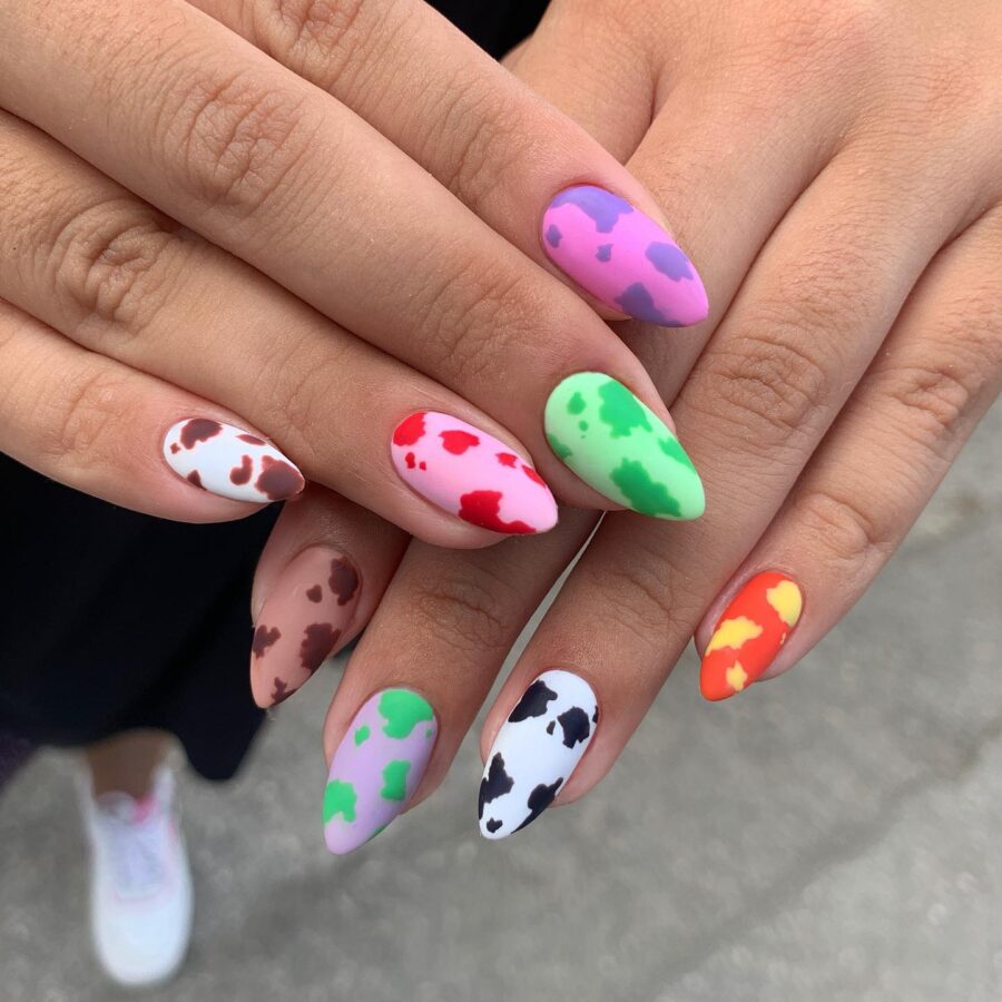 Vibrant cow print nails for playful vibes