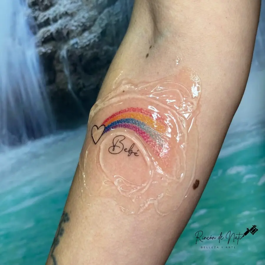 Vibrant rainbow tattoo symbolizing hope and love
