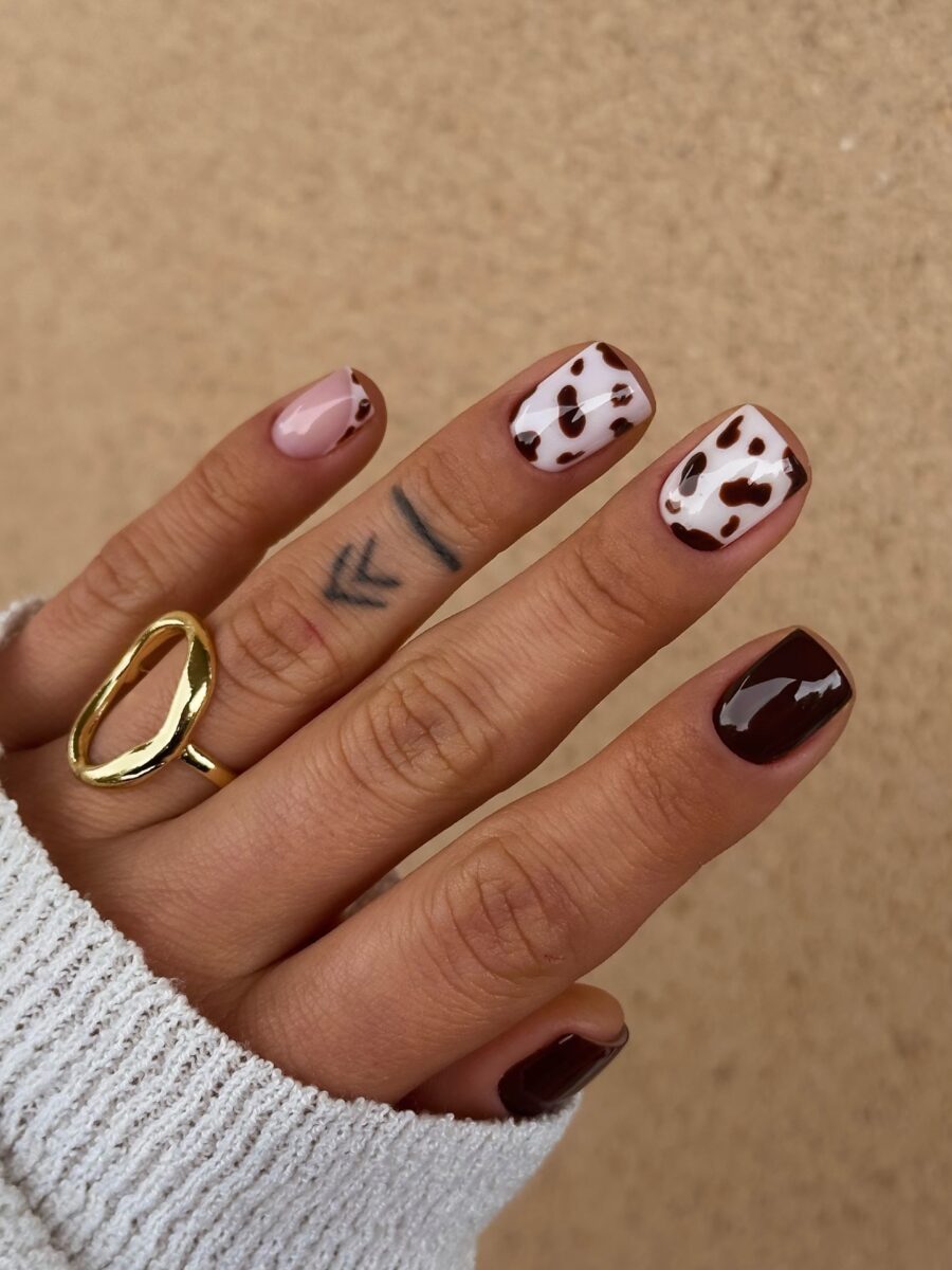 Stylish cow print nails with chic accents