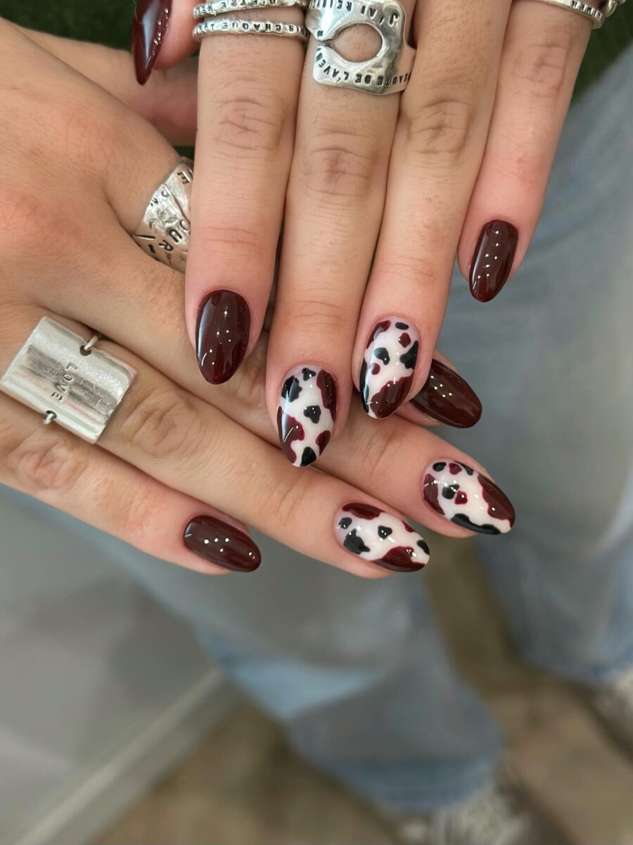 Trendy cow print nails with bold colors