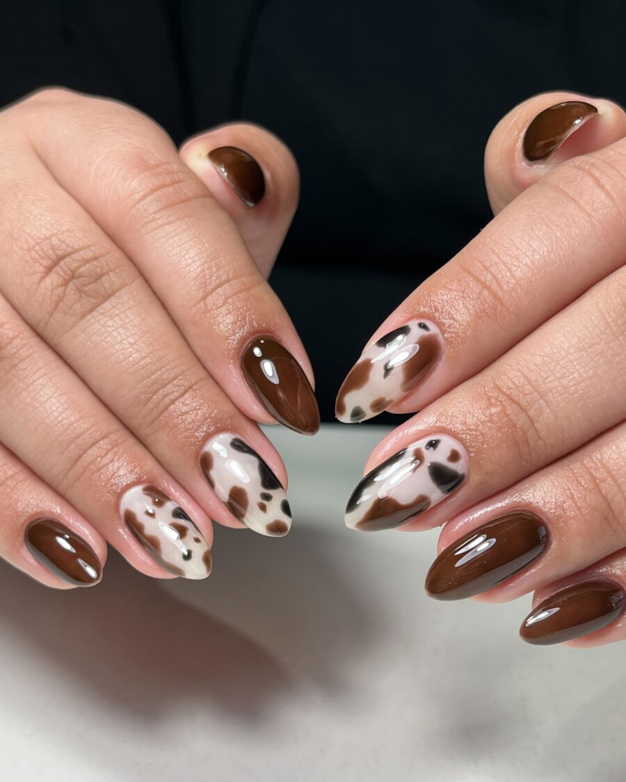 Chic cow print nails with rich brown hues