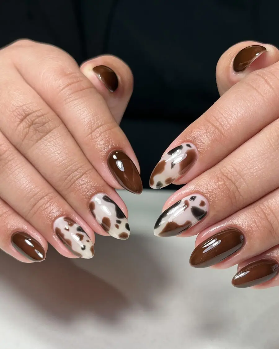 Chic cow print nails with rich brown hues