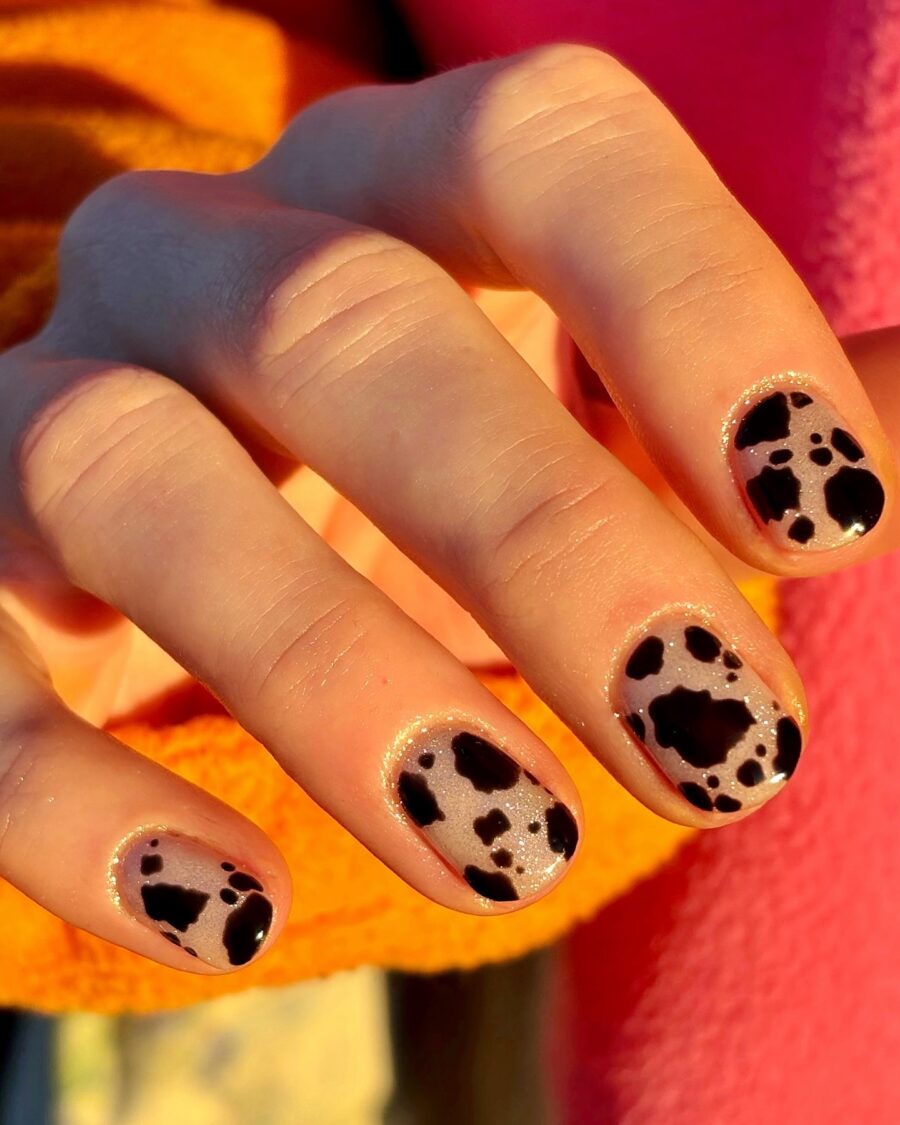 Chic cow print nails for a trendy look
