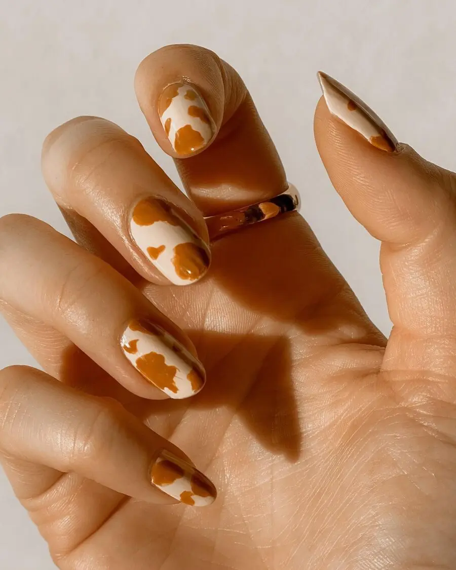 Chic cow print nails for a trendy look