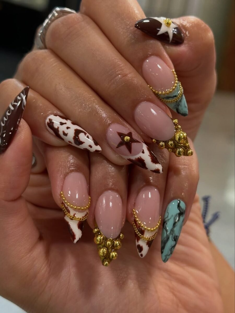 Chic cow print nails with elegant accents