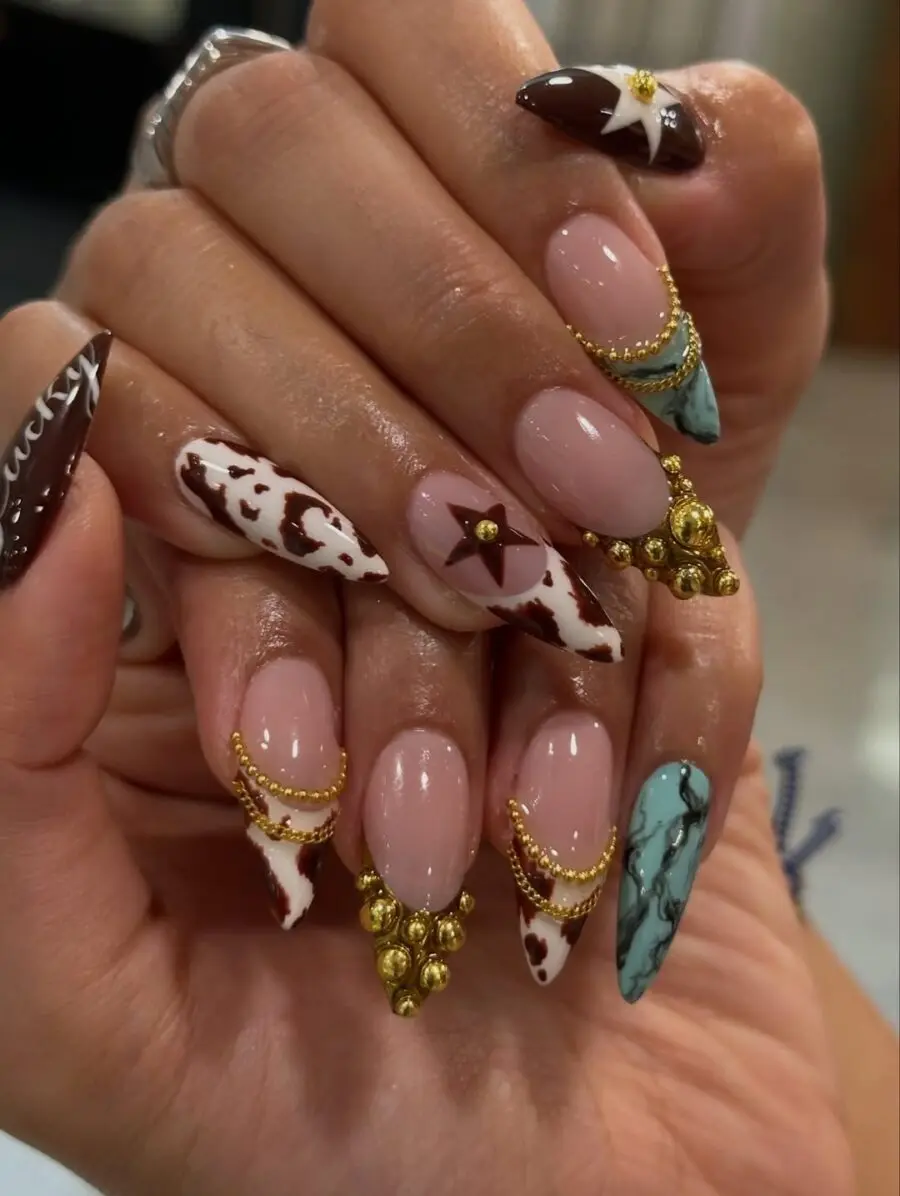 Chic cow print nails with elegant accents