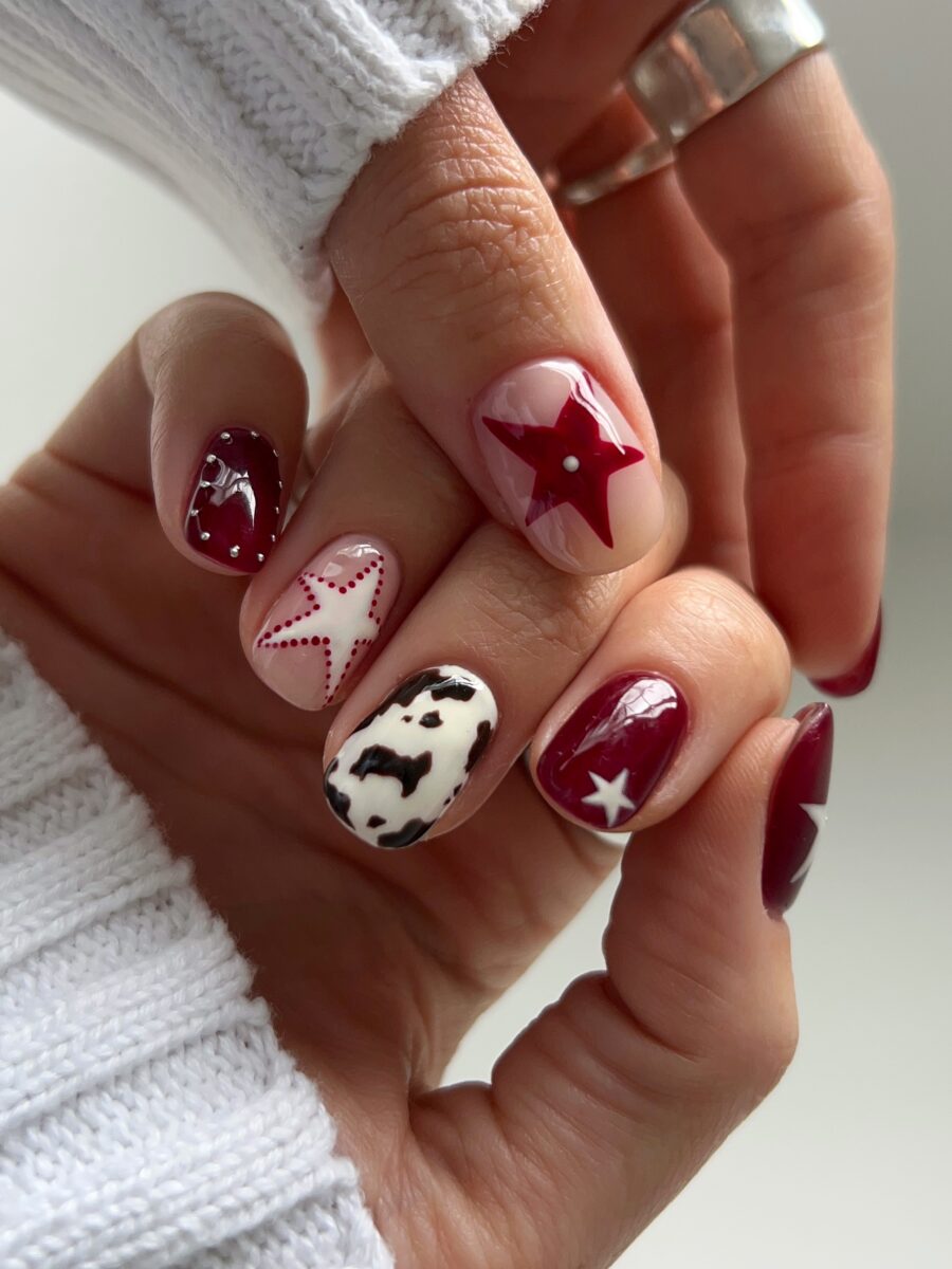 Chic cow print nails with star accents