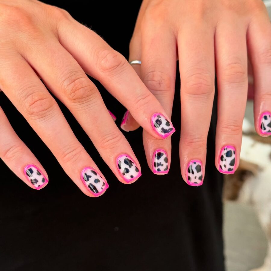 Playful Cow Print Nails with Pink Highlights