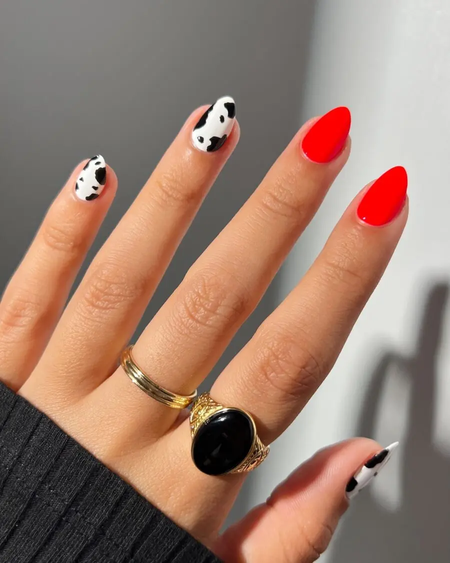 Bold cow print meets vibrant red tones