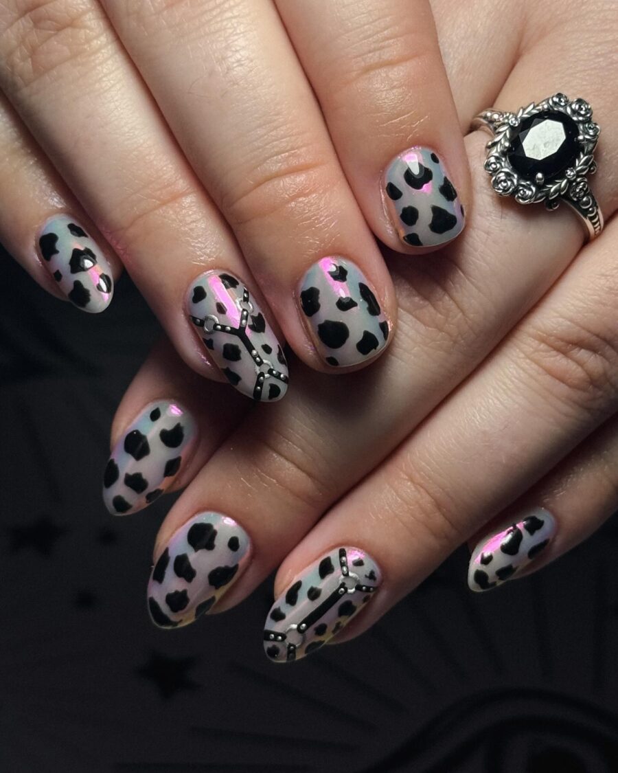 Chic cow print nails with stylish accents