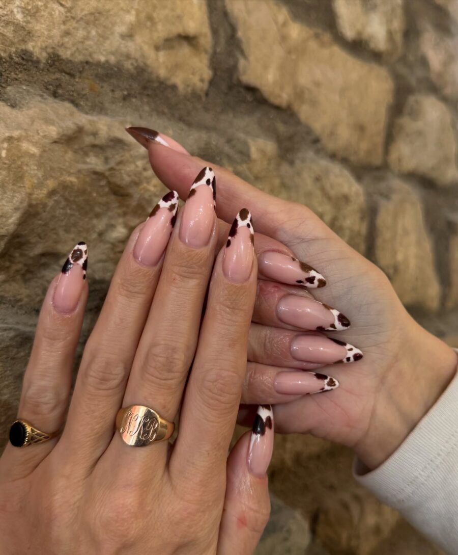 Chic cow print nails with elegant accents