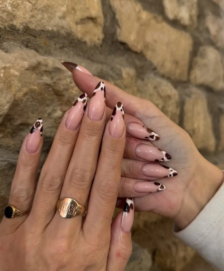 Chic cow print nails with elegant accents