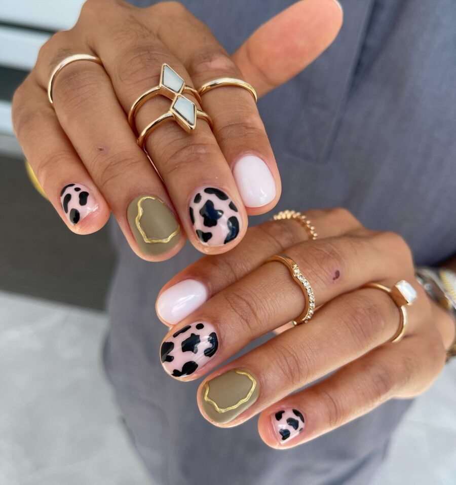 Stylish Cow Print Nails with Chic Accents